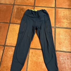 Athleta Ranier tights in dark teal. Size medium. Preloved with lots of life.